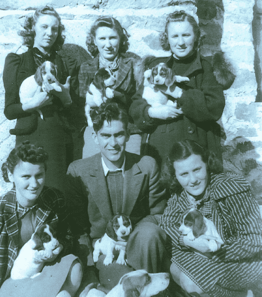 black and white image of the lynch children with puppies