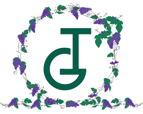Green monogram "T" with purple floral wreath.